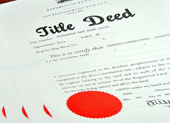Documents and keys on a table during a property transaction